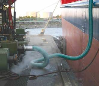 High temperature composite hose is transferring petroleum fluid from ship to shore.