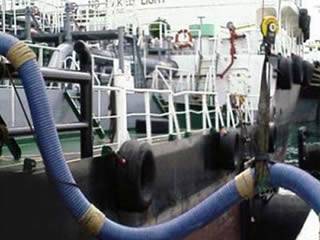 Marine composite hose is delivering petroleum products from ship to shore.