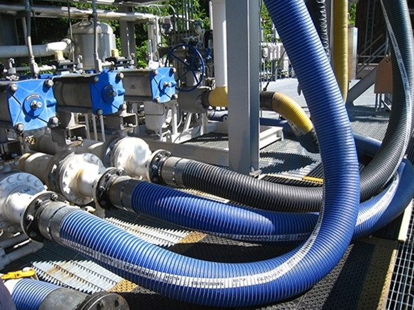PTFE composite hoses installed in an automotive repair shop.
