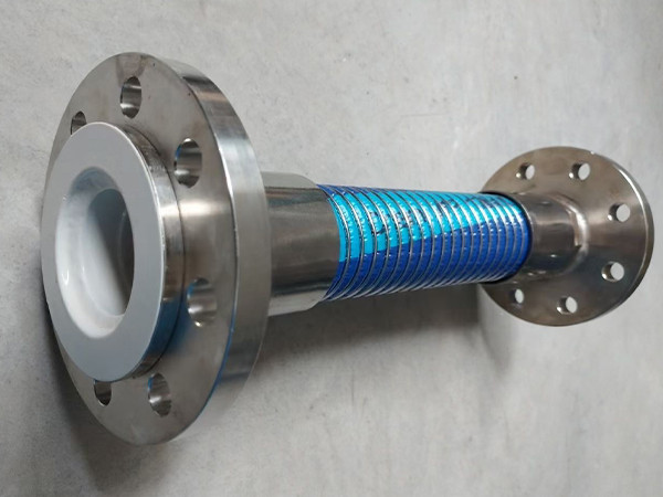 A PTFE composite hose with two flanges on the ground