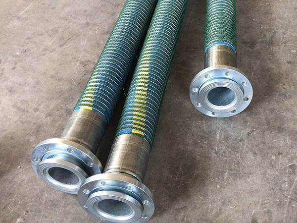4 green suction & discharge composite hoses with joints on the ground